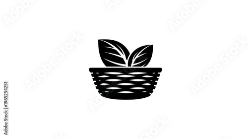 A simple black and white illustration of a woven basket containing two leaves