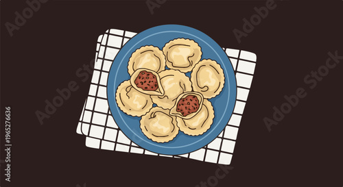 Plate of delicious, cartoonish ravioli on checkered cloth