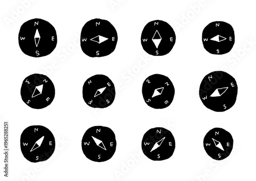 様々な方位を指し示す黒い方位磁針の手描きイラストセット