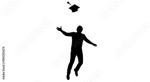Silhouette of man throwing graduation cap.