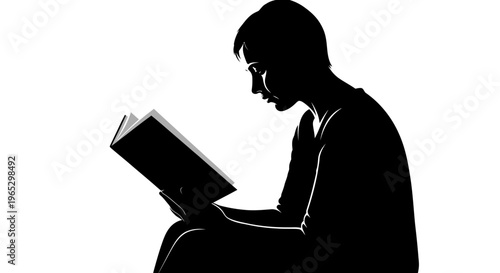 Silhouette of a person reading book.