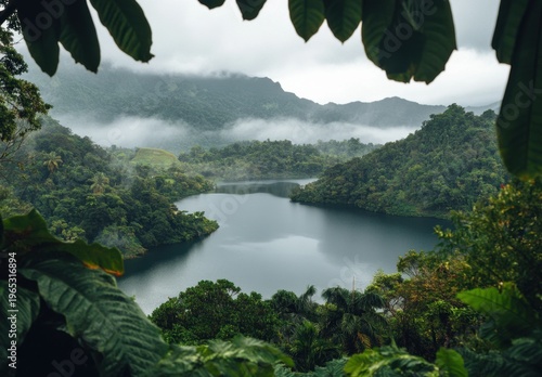 Misty Tropical Lake Surrounded by Lush Rainforest and Mountain Clouds