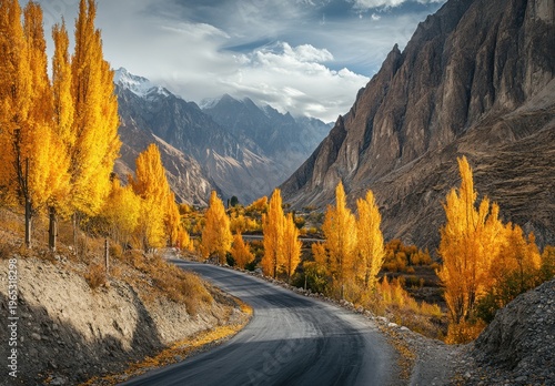Winding Mountain Road Through Vibrant Autumn Poplar Trees in Karakoram Valley