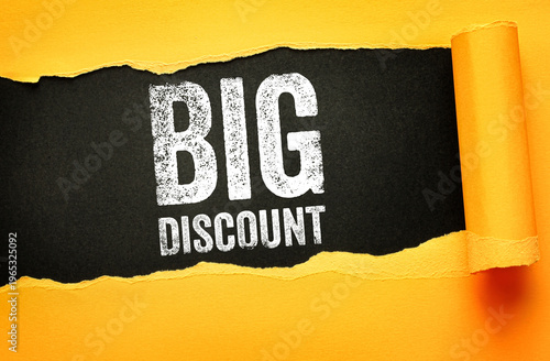 BIG DISCOUNT text appearing behind torn paper. Marketing visual for retail sale, clearance, special offer, and business promotion with a textured effect