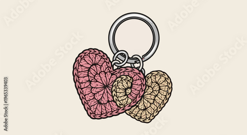Two crocheted hearts, one pink, one yellow, attached to a silver keyring