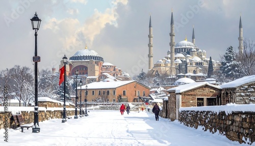 Snow-covered pathway with historic buildings and people