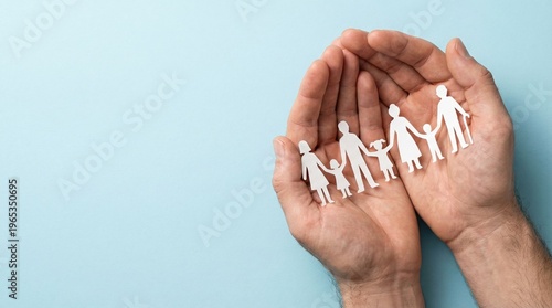 Hands cradling a family of paper cutouts on a light blue background symbolizing protection and care
