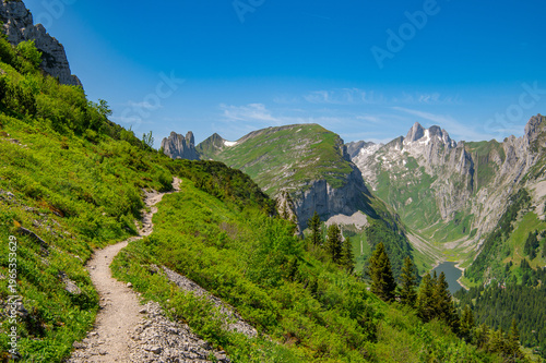 Hiking trail at Saxer Lücke, Appenzell Alps, Switzerland with mountain landscape and alpine valley view