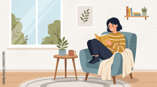 A young woman is happily reading a book while sitting comfortably in a soft armchair next to a window with trees outside.
