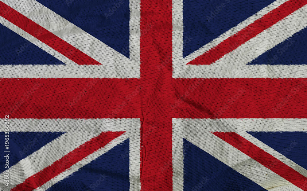 Fototapeta premium Vintage Union Jack Fabric Flag Of The United Kingdom With Worn Texture And Folded Details