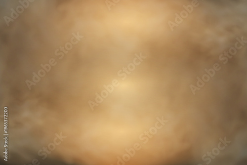 Abstract background showing blurred warm tones, smoke, and light