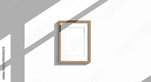 Minimalist wood frame on white wall with light and shadow patterns