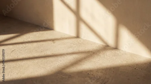 Obraz Concrete texture photograph with strong sunlight creating dramatic, angular shadows on a warm-toned surface.