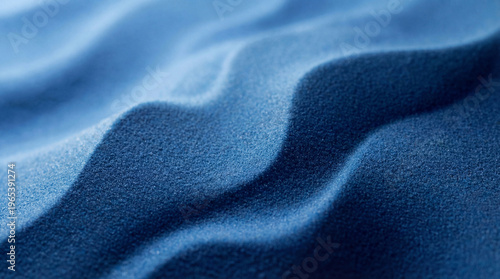 Abstract blue sand texture photograph featuring delicate, undulating wave patterns and soft gradients under even light.