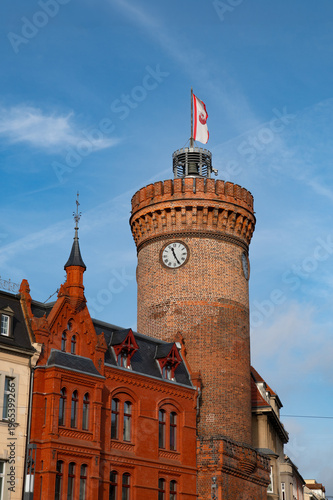 Spremberger Turm in Cottbus, Germany with historic brick tower and clock under blue sky