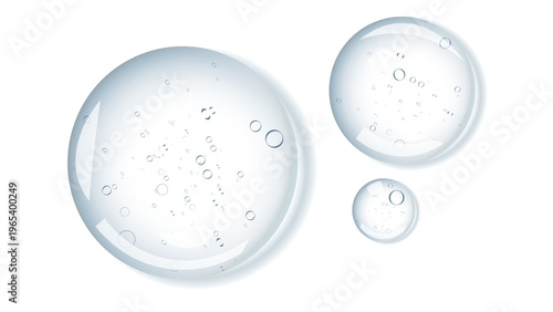 Fotografie A few drops of transparent cosmetic product on top of the background