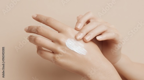 Elegant female hands with moisturizing cream on smooth skin