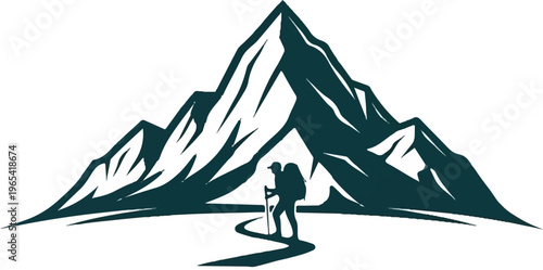 Hiker ascends a winding path towards a majestic mountain silhouette