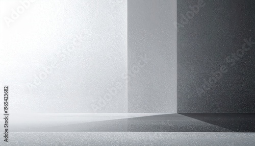 Fond de studio moderne avec une architecture géométrique épurée et des ombres douces sur des surfaces grises texturées pour un design contemporain.