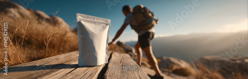 Adventurous hiker placing product package on a mountain path, perfect for advertisement.