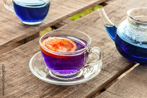 Blue and purple tea, an infusion of butterfly pea flowers, with a citrus