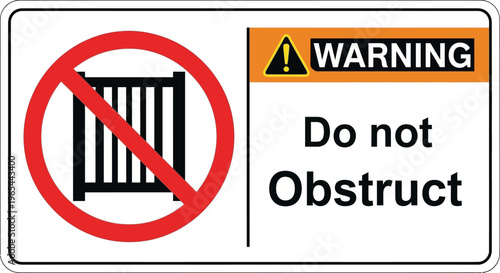 A warning sign displays a do not obstruct message with a barred gate symbol