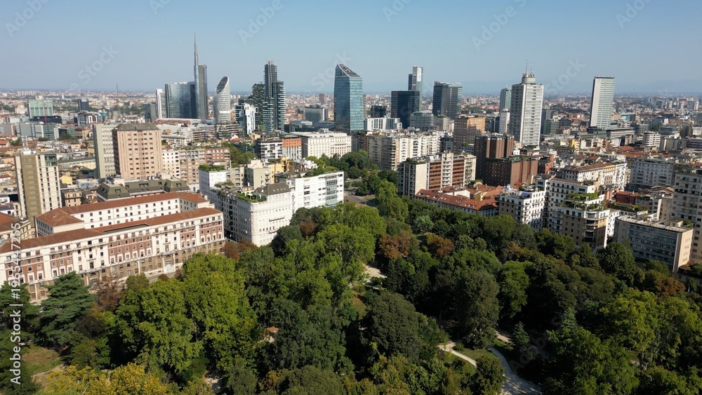 Fototapeta premium urope, Italy, MIlan 03,30,2026 drone aerial view of Milan downtown fashion district , Corso Venezia, Villa Reale , Montanelli urban park and new skyline Garibaldi Gae Aulenti with skyscrapers 