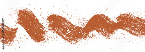 Textured brown brush stroke with scattered particles