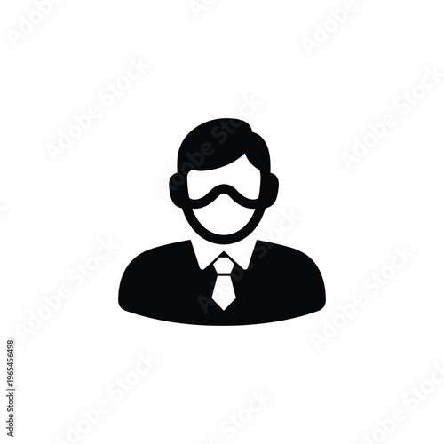 Black and white of a man wearing a suit and tie with a mustache