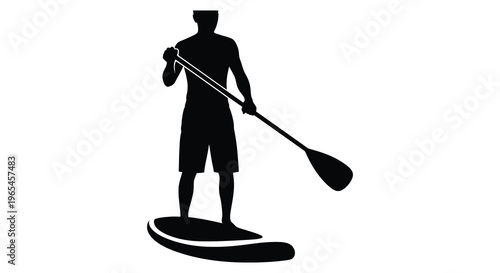 A lone figure stand up paddleboarding on calm waters depicted as a striking black silhouette high quality professional