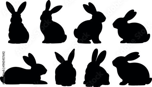 Set of nine black silhouette rabbits sitting and standing isolated on white background minimalist design