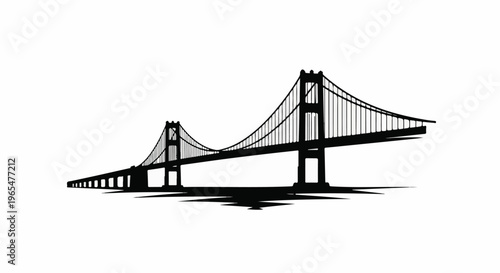 Iconic suspension bridge in silhouette with dramatic shadows