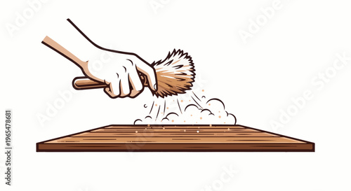 Hand using a brush to dust particles off a wooden surface