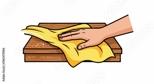 Hand cleaning wooden surface with yellow cloth, small particles present