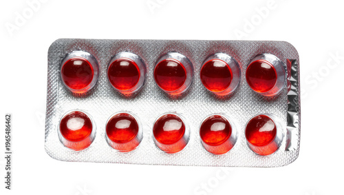 Isolated ten shiny red gel capsules in silver blister pack for medication and healthcare