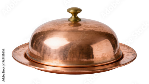 Isolated rustic antique copper butter dish with a dome lid and elegant brass handle.