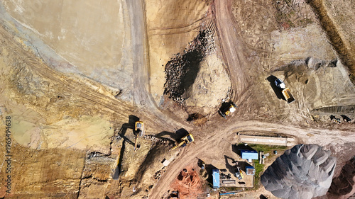 Aerial View of Construction Site with Excavators and Heavy Machinery
