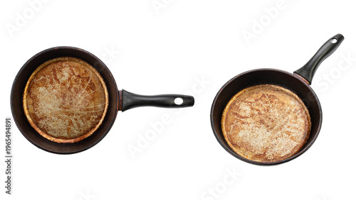 Old dirty frying pans with burnt bottom isolated on white background with clipping path. File contains clipping path.