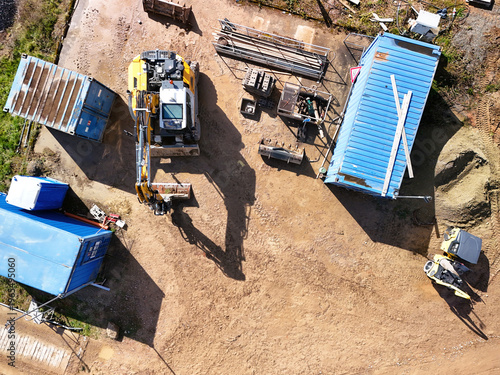 Aerial View of Construction Site with Excavators and Heavy Machinery