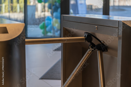 Access control turnstile gate in modern office entrance with security system