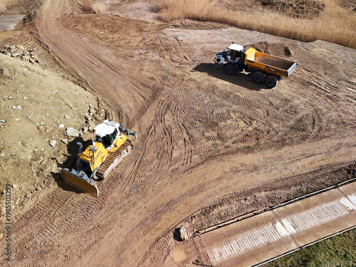 Aerial View of Construction Site with Excavators and Heavy Machinery