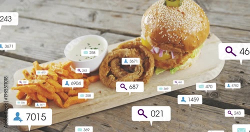 Floating UI badges growing around sesame burger, onion ring and fries on wood board showing growth