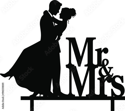 Black silhouette of a bride and groom embracing next to mr and mrs text on a cake topper wedding couple