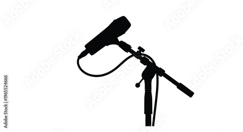 A black microphone on a stand dramatically presented as a silhouette