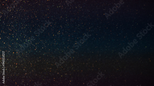 Abstract background with shimmering particles and bokeh effect in dark tones for design use