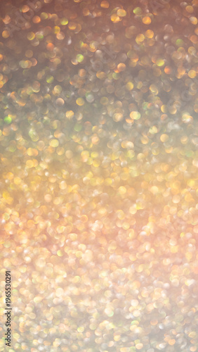 Abstract golden bokeh background with soft blurred lights in warm tones for design projects