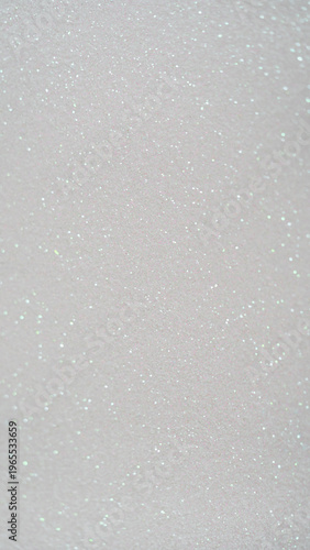 White glitter background with sparkling texture for design, craft, or decoration projects