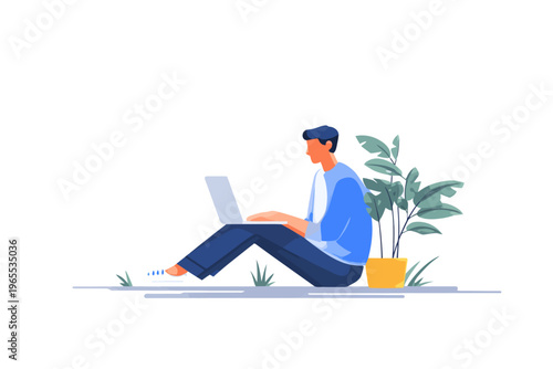 Young caucasian male sitting on floor with laptop and plant in bright room