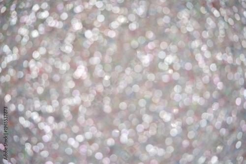 Abstract blurred background with shimmering bokeh lights in soft pastel colors