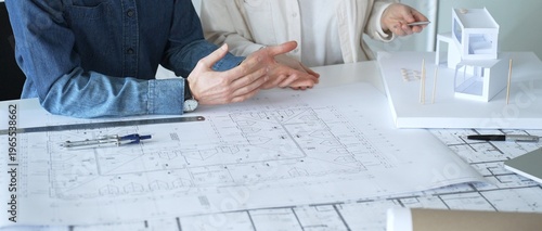 Εκτύπωση καμβά Architects discussing building plans, reviewing blueprints and architectural mod
